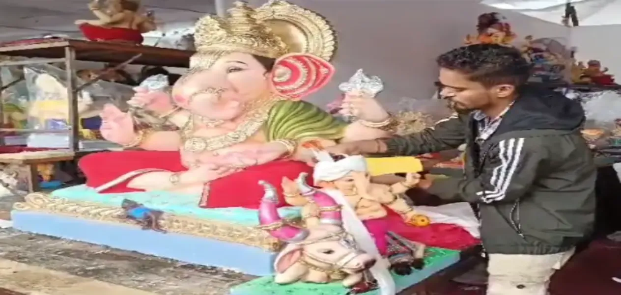 Aslam Sayyad of Nashik decorates the idols of Ganpati Bappa