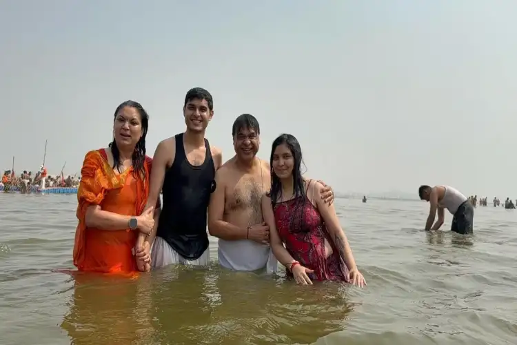 Assam CM, family take holy dip at Sangam